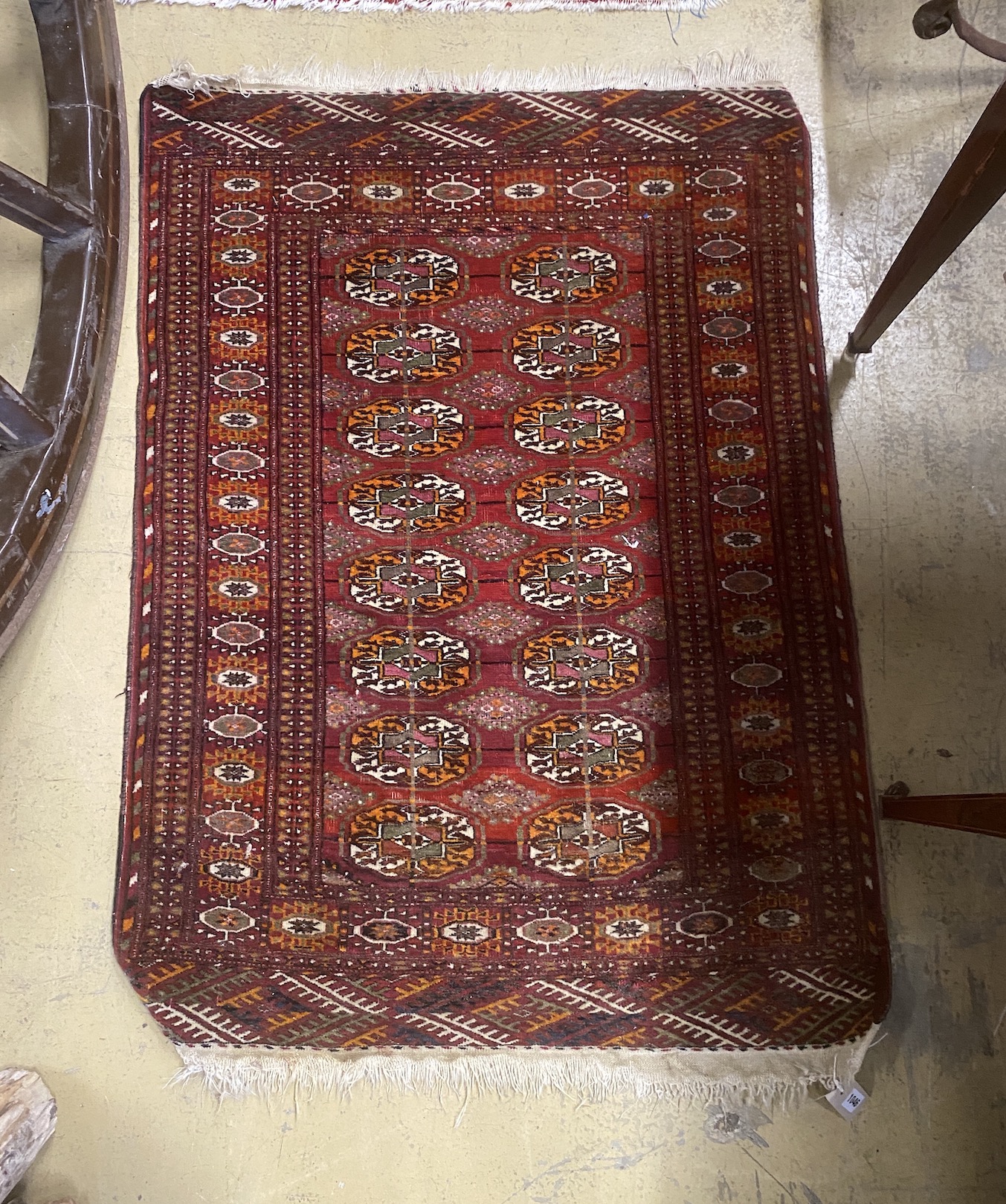A North West Persian rug and a Bokhara rug, larger 114 x 84cm